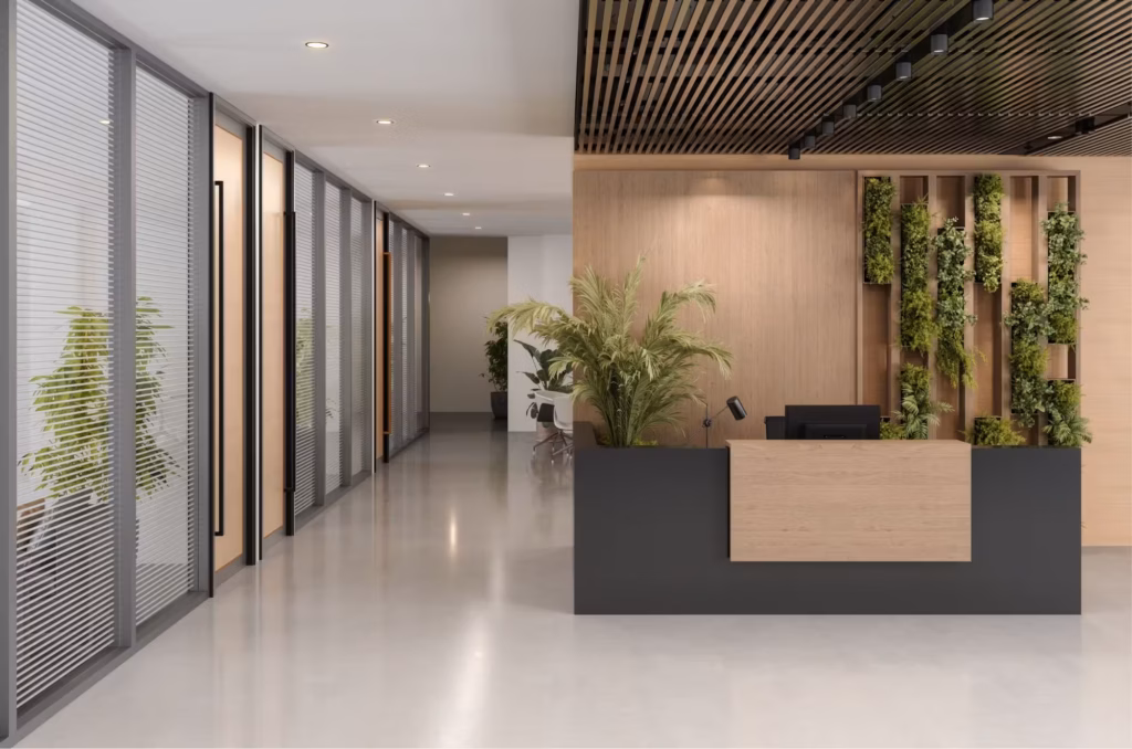 Recepcija poslovnog prostora sa pažljivo uklopljenim zelenilom.
